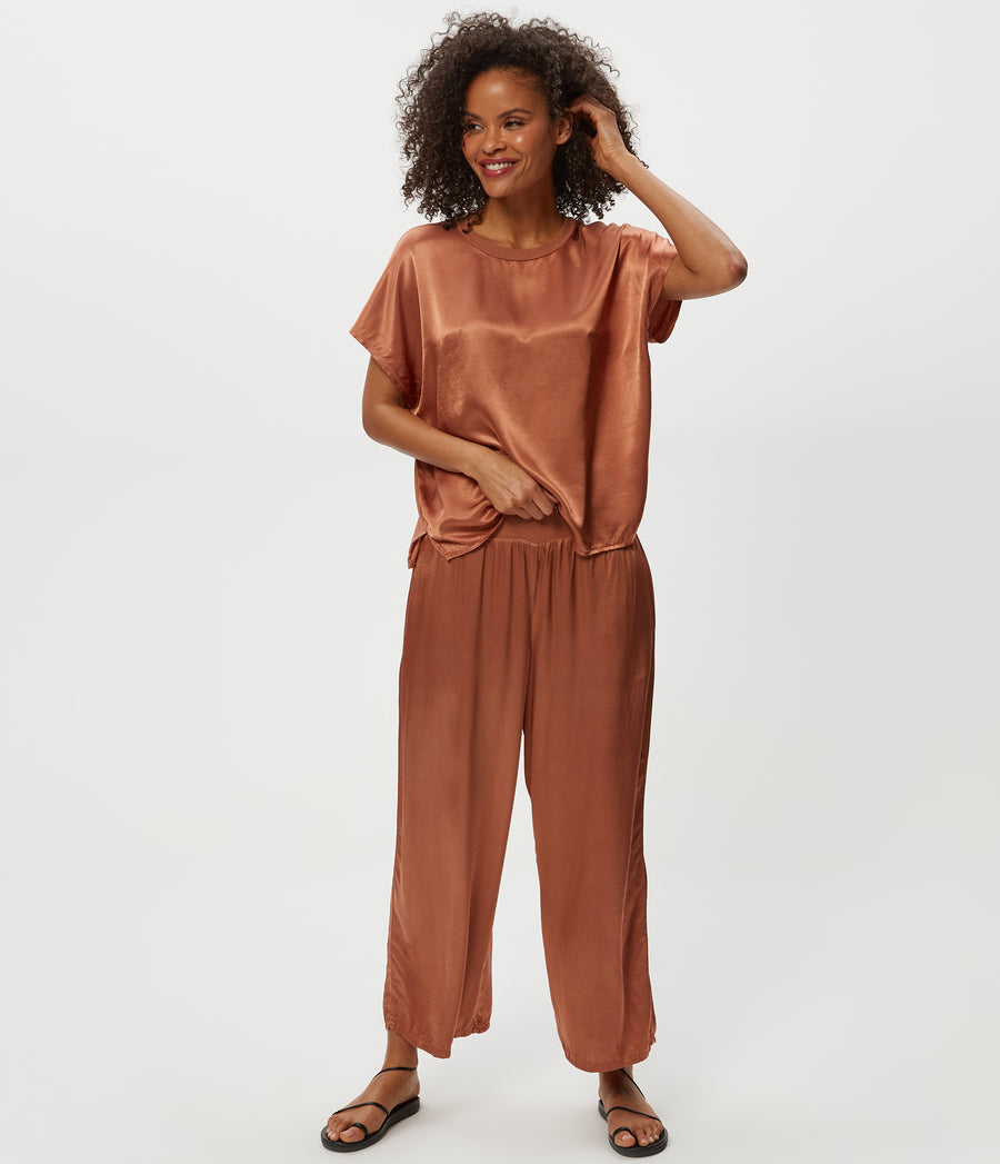 Sacha Satin Cropped Pant in TERRA Orange Close Up View #TERRA