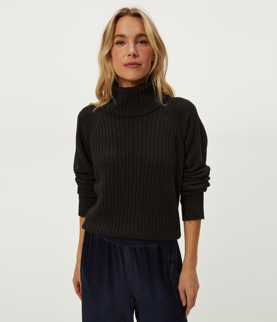 Storm Turtleneck Sweater in Black Close up View #BLACK